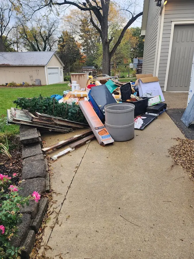 Dumpster being loaded with debris for 30 Yard Dumpster Rental in Hattiesburg